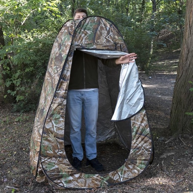 Standing inside the shower tent to show headroom